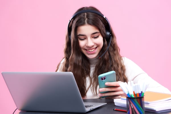 A person with long hair checking messages from a hybrid teammate